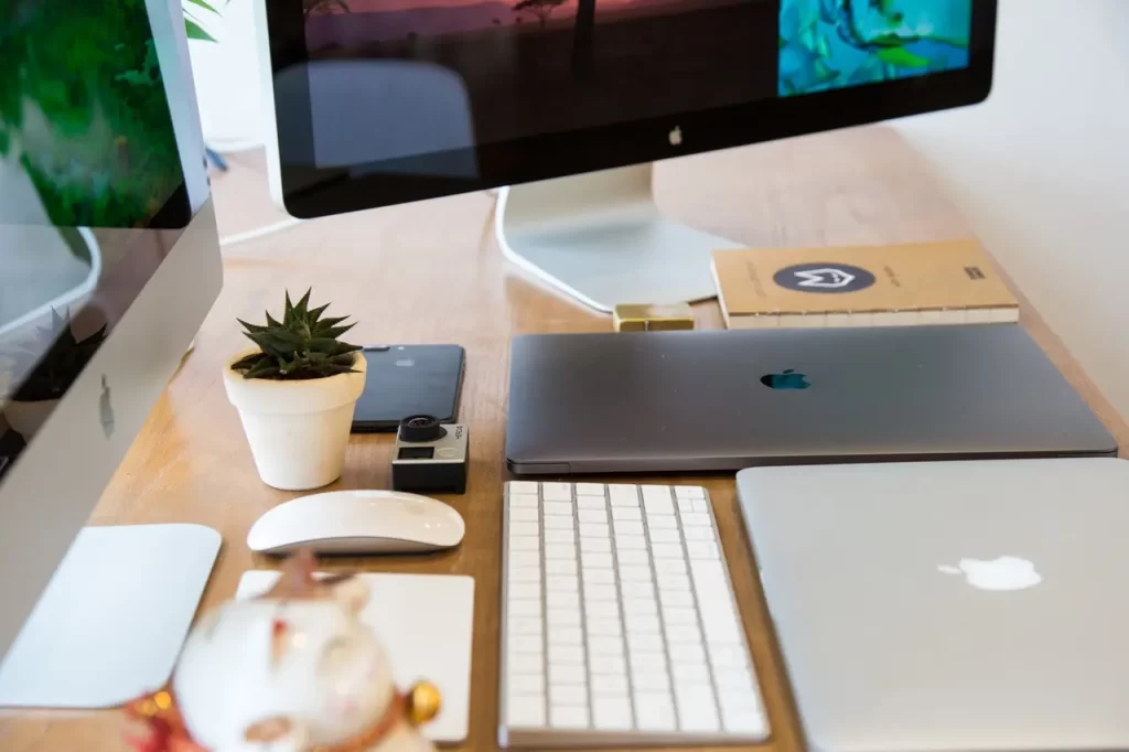 Home office desk with many devices